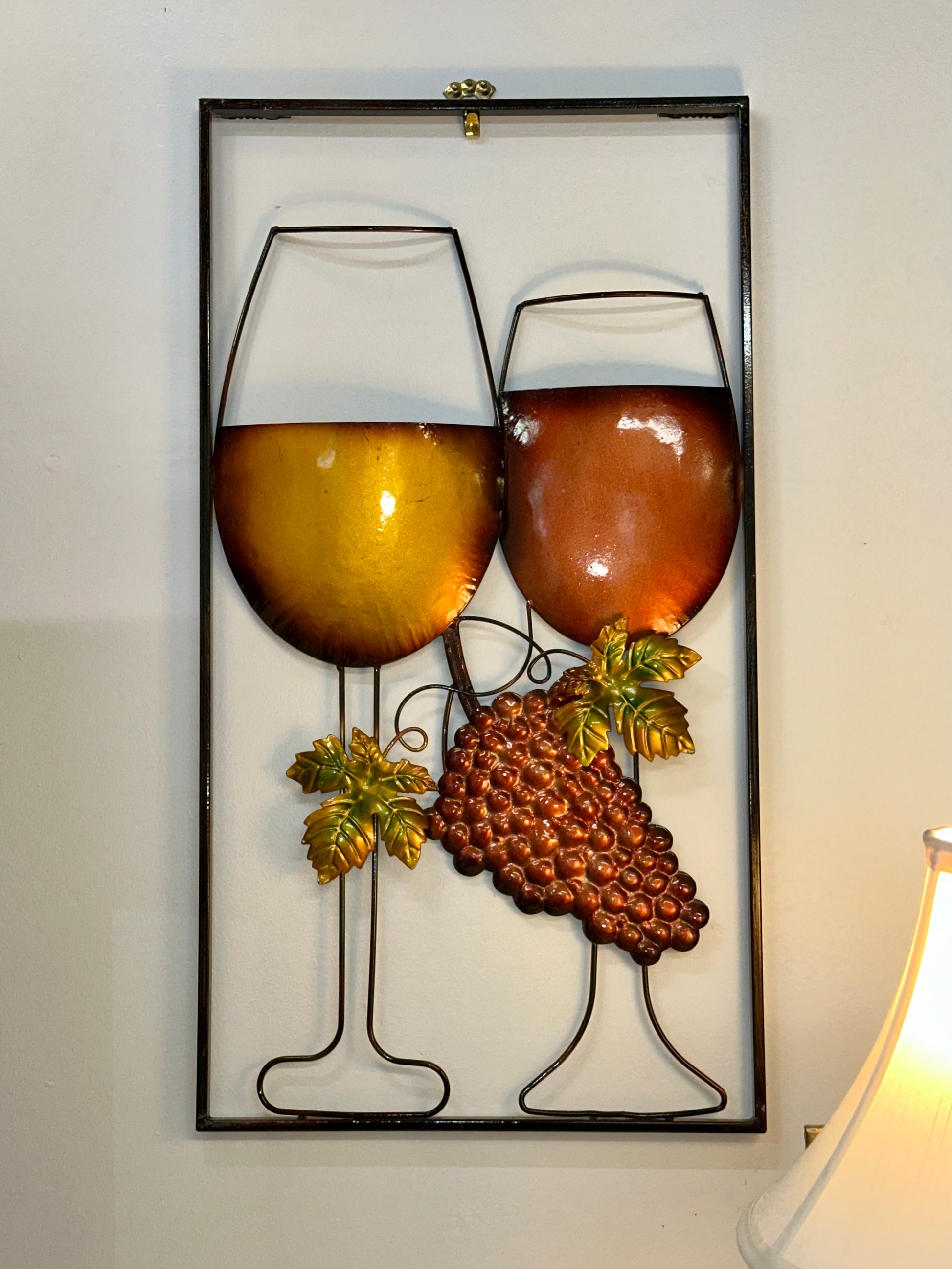 Framed vineyard themed metal wall art with wine glasses and grape cluster