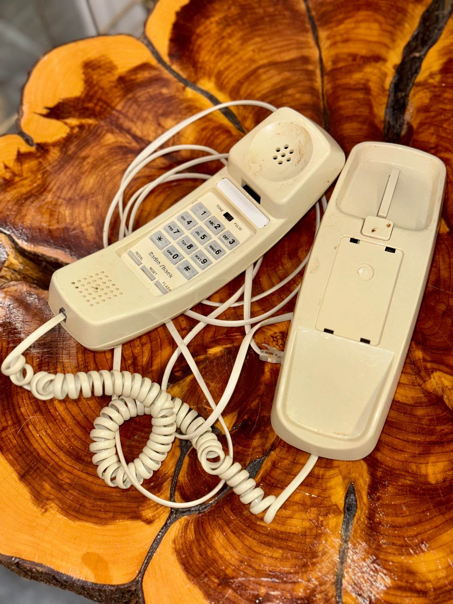 Vintage push-button landline phone on wooden table