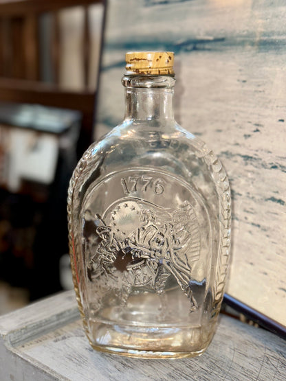 Vintage 1776 Bicentennial glass decanter bottle with embossed Revolutionary War drummer design and original stopper
