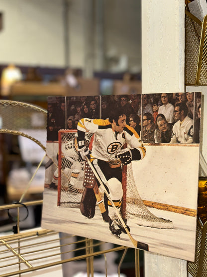 Vintage Boston Bruins hockey wall art featuring classic NHL game action and goal crease defense