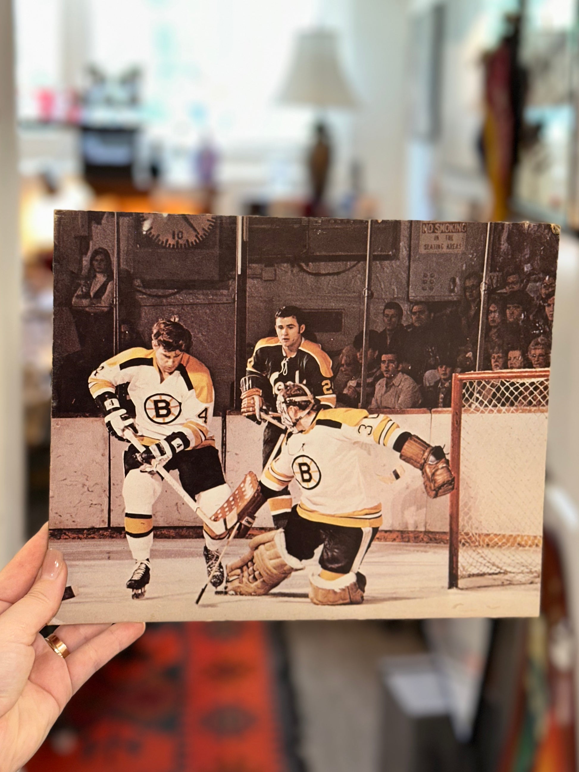 NHL hockey wall art with Boston Bruins players defending the net during a game