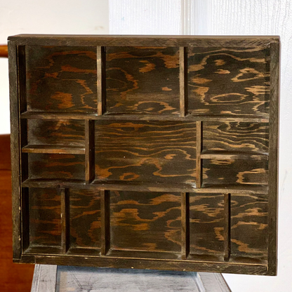 Geometric wooden curio shelf with decorative compartments for displaying collectibles, crystals, and figurines