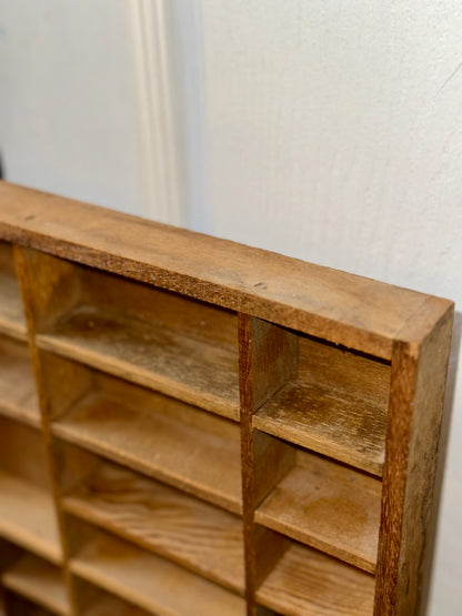 Large vintage printer’s tray display case with numerous storage compartments for small treasures and keepsakes