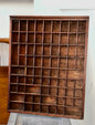 Rustic wooden display organizers and printer’s trays for showcasing collectibles, antiques, and small décor items