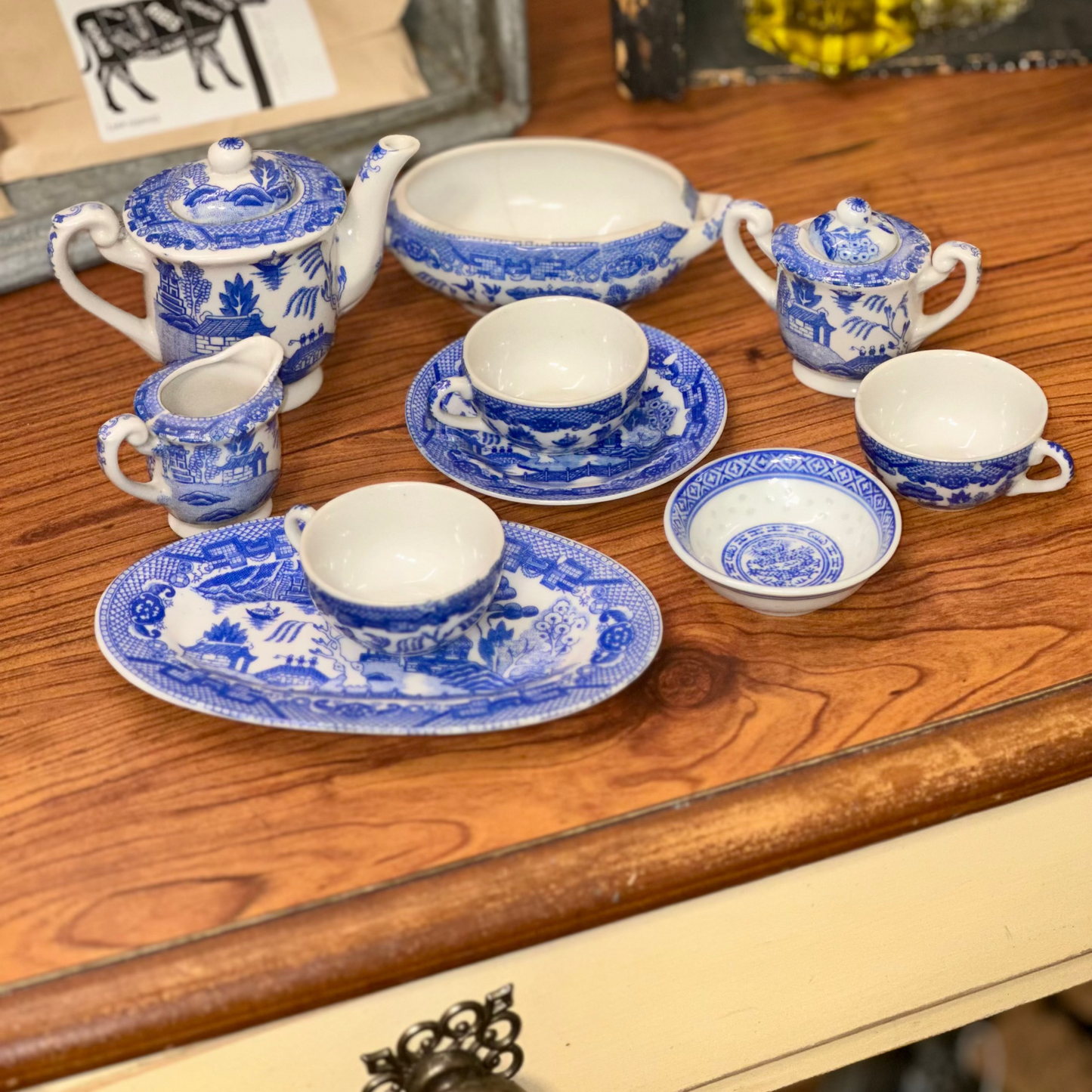 Vintage Blue Willow miniature tea set made in Japan displayed on wooden table