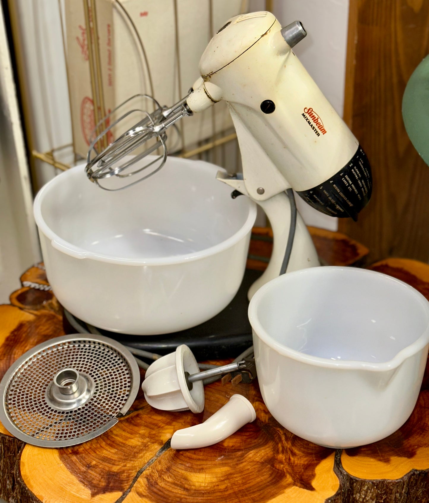 Classic Sunbeam Mixmaster stand mixer featuring milk glass bowl and beaters