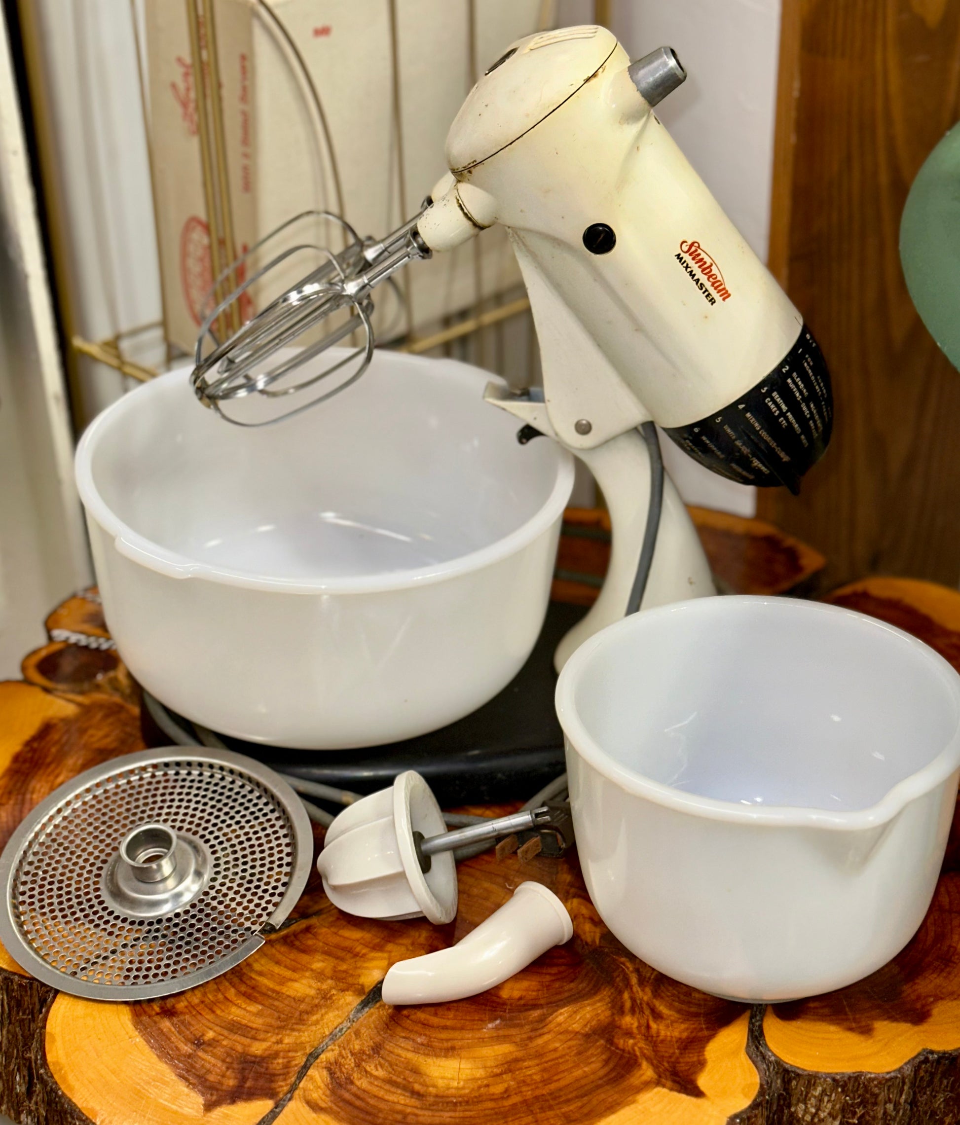 Classic Sunbeam Mixmaster stand mixer featuring milk glass bowl and beaters
