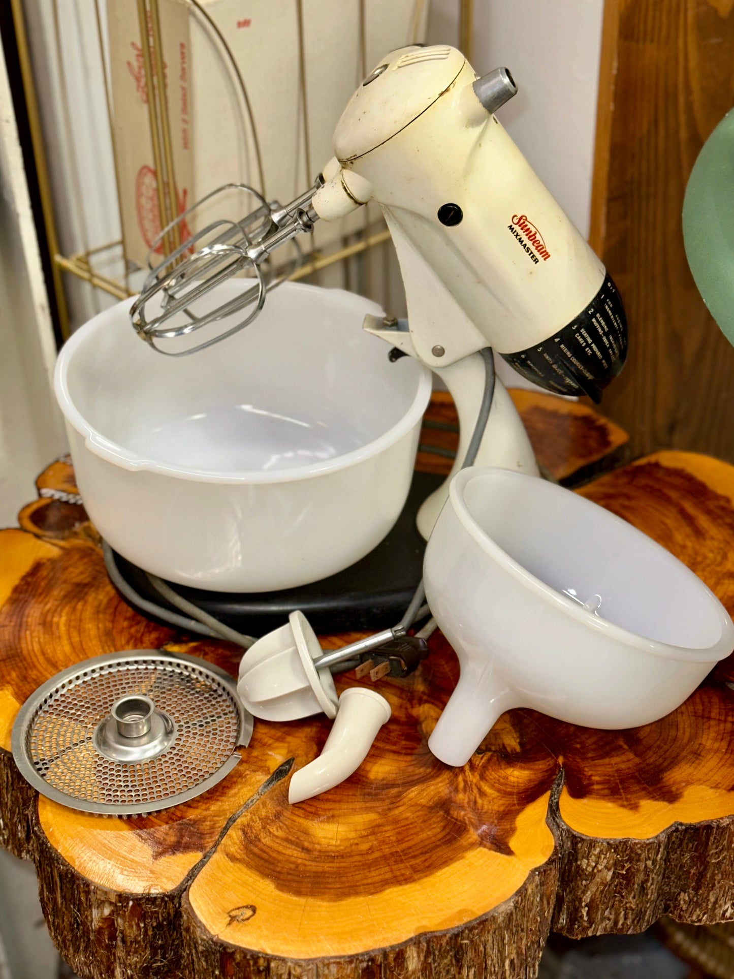 Mid-century Sunbeam Mixmaster electric mixer in ivory finish with accessories