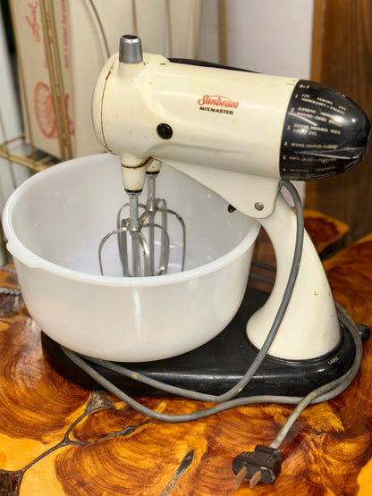 Vintage Sunbeam Mixmaster stand mixer with original milk glass mixing bowls and attachments