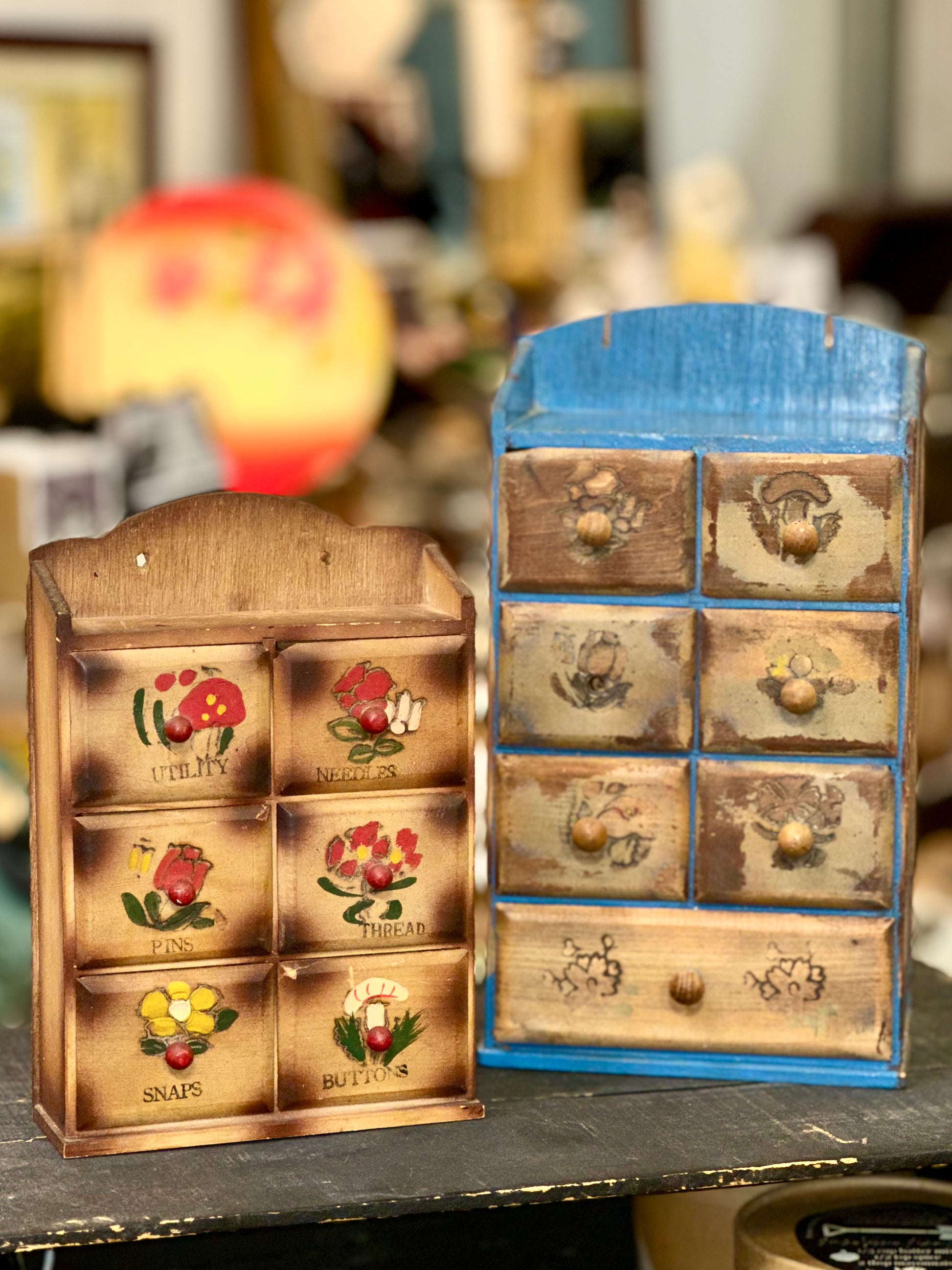 Vintage wooden organizer cabinets with hand-painted floral drawer fronts