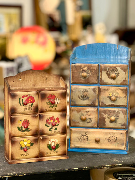 Vintage wooden organizer cabinets with hand-painted floral drawer fronts