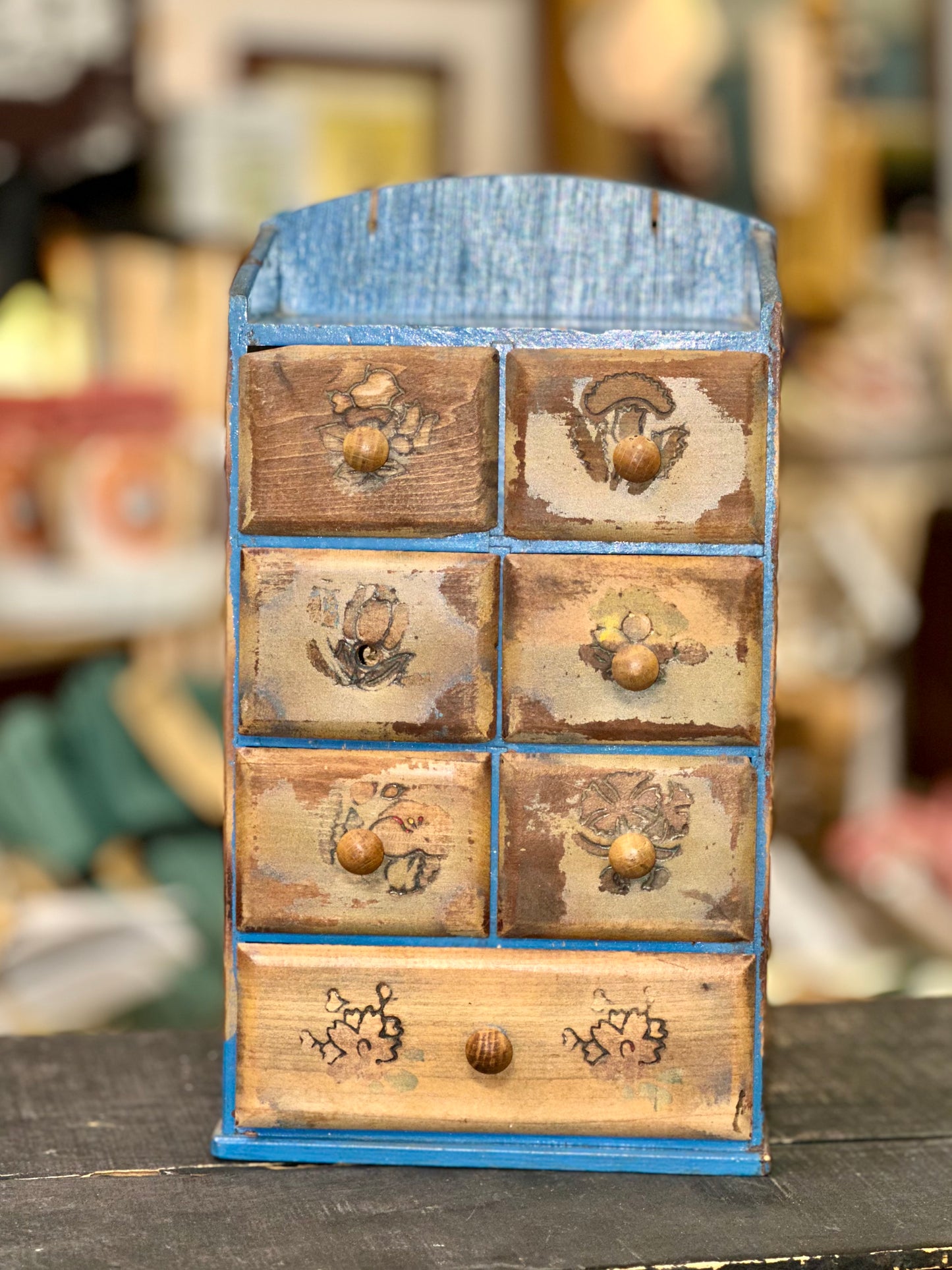 Rustic farmhouse storage drawers with folk art floral designs