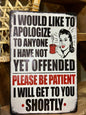 Funny vintage-style metal tin sign with sarcastic apology quote.
