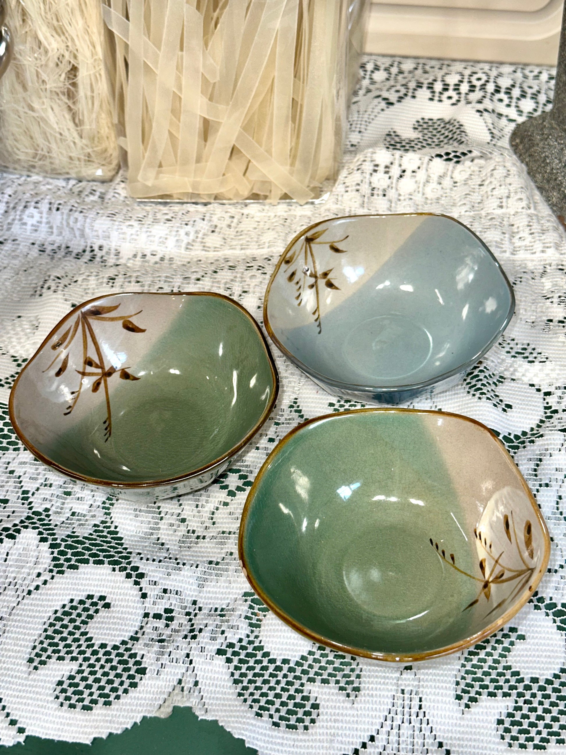 Set of three vintage Japanese stoneware bowls with green and blue glaze.