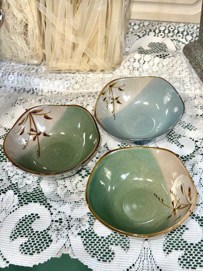 Set of three vintage Japanese stoneware bowls with green and blue glaze.