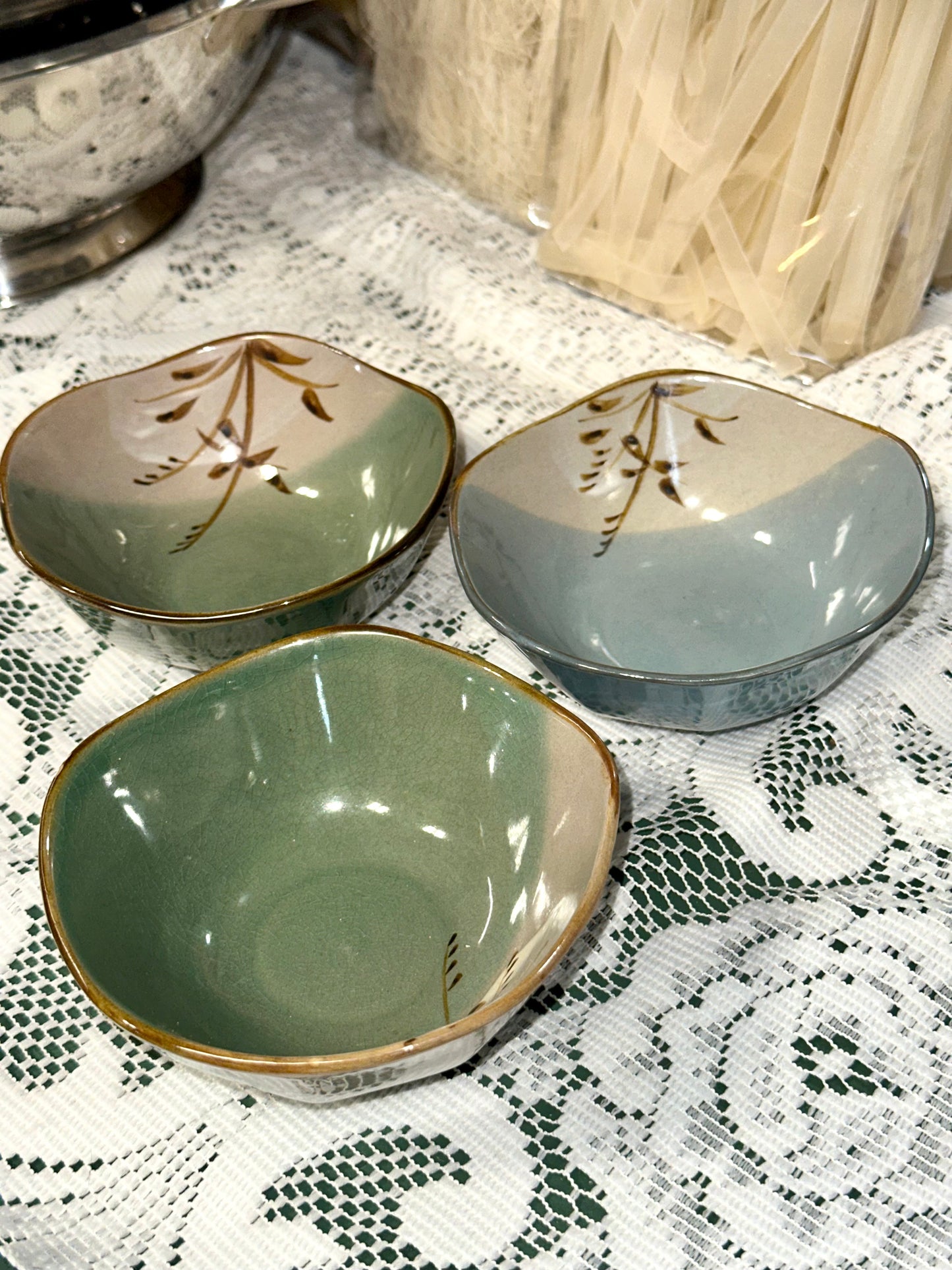 Vintage Japanese serving bowls with rustic brown trim.