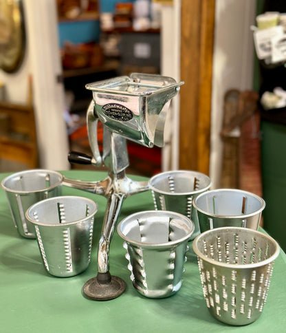 Saladmaster countertop hand crank vegetable slicer and cheese grater.