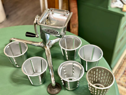 Saladmaster countertop hand crank vegetable slicer and cheese grater with six drums.