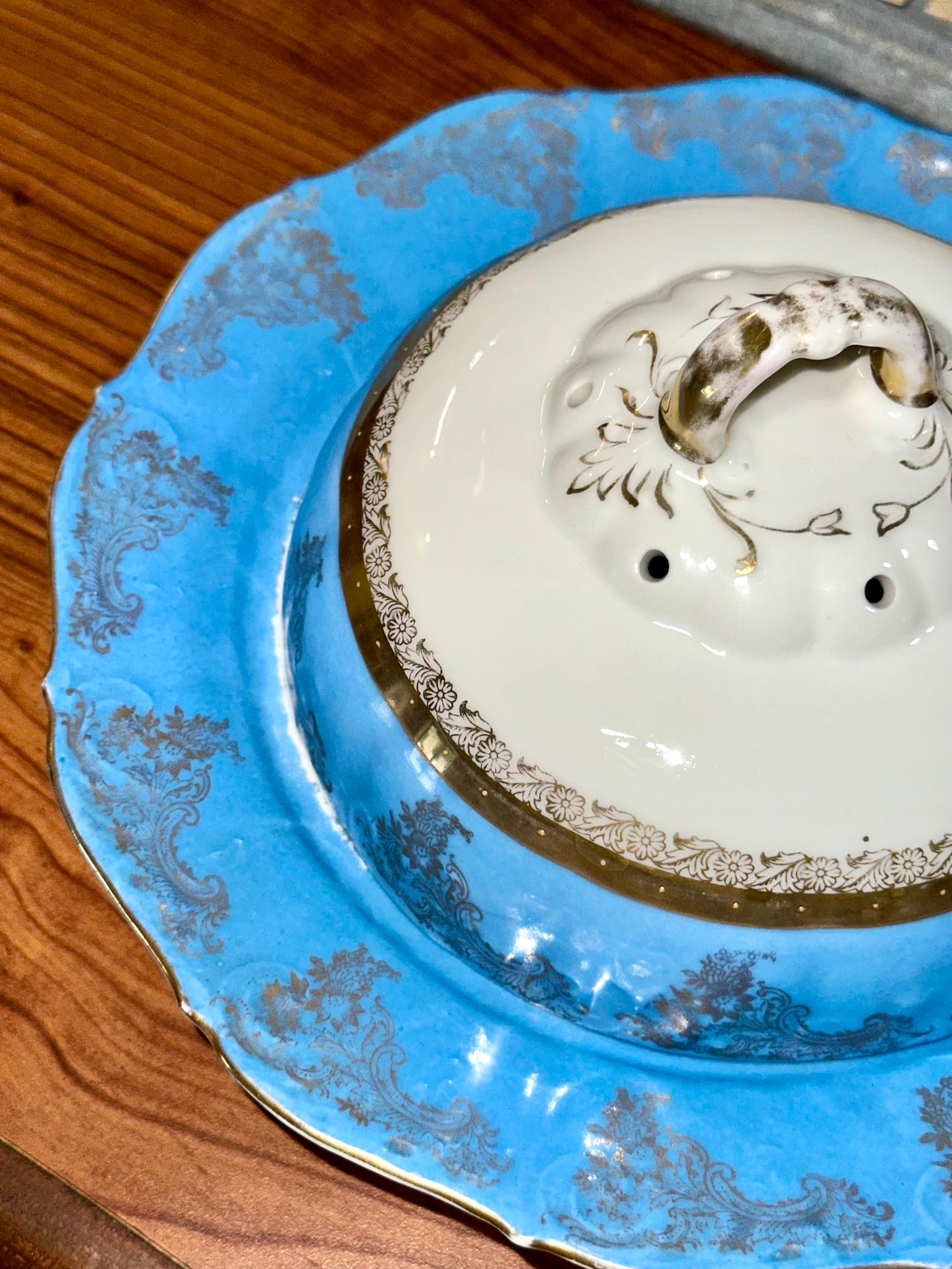 Antique covered serving bowl with gold pattern
