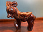 Vintage ceramic McCoy style donkey planter with glossy brown drip glaze and decorative saddle