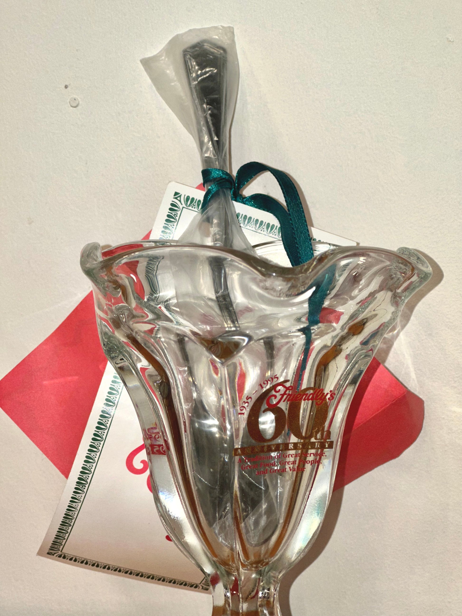 Close-up of Friendly’s 60th anniversary 1935–1995 logo on glass dish