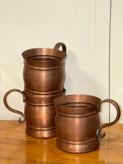 Set of vintage solid copper tankard mugs with decorative curled handles