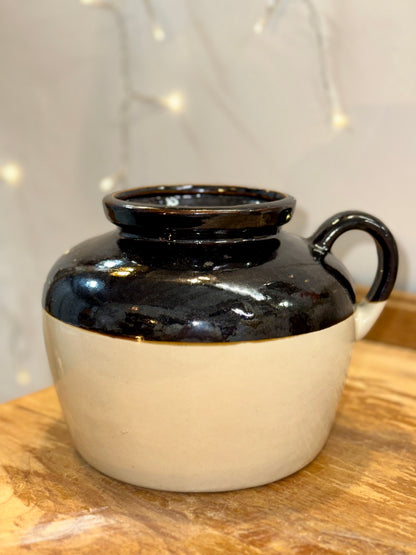 Black and cream ceramic bean pot with two handles