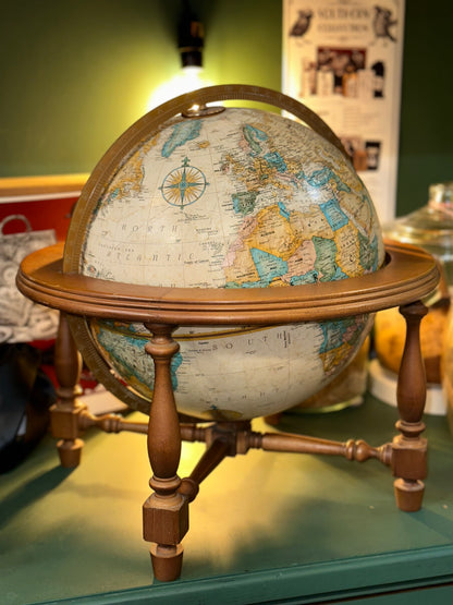 Vintage world globe with wooden stand