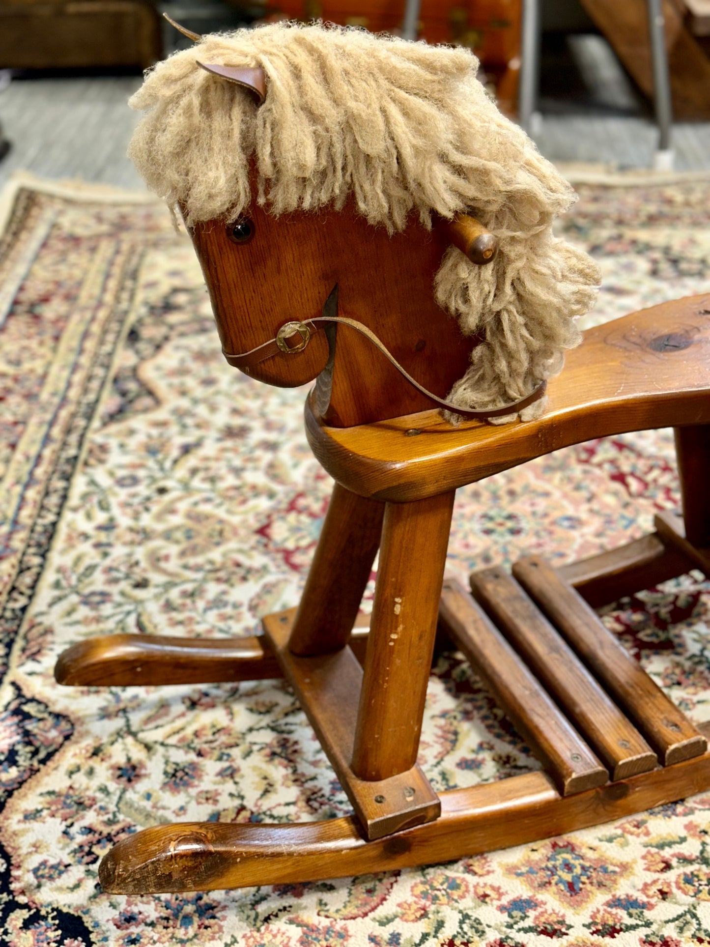 vintage wooden rocking horse with wool mane