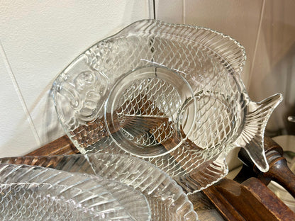 Small clear glass fish dish with raised center 8 inch