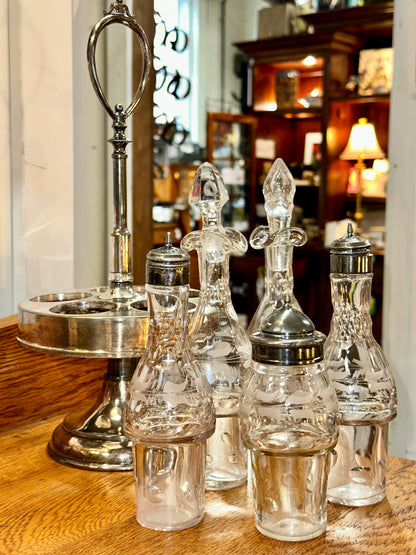 Five-piece vintage condiment set with glass bottles and revolving holder