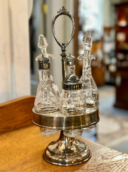 Vintage glass salt pepper shakers and cruets with silver-tone revolving stand