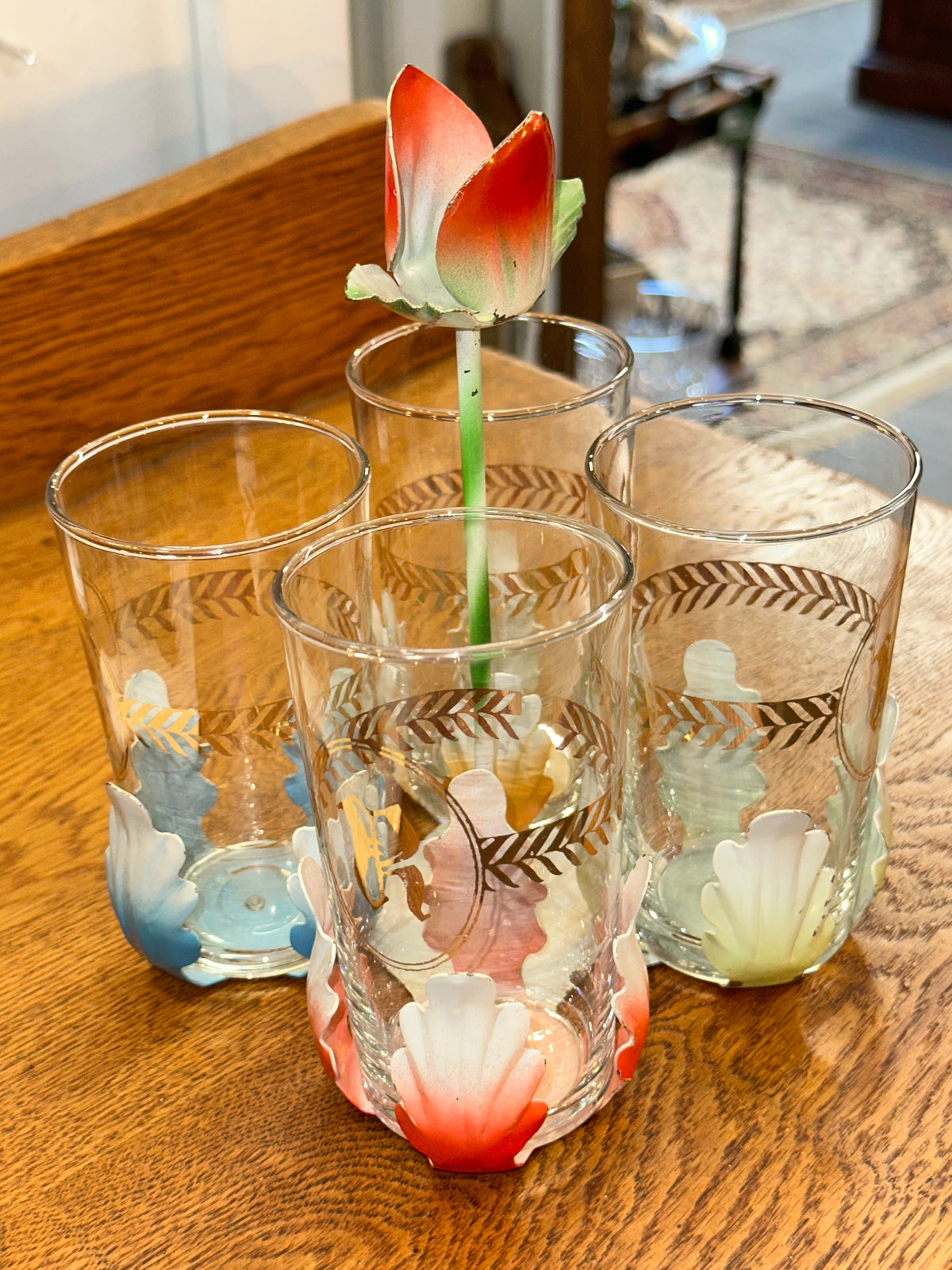 Vintage set of four floral glasses with metal holder and flower centerpiece