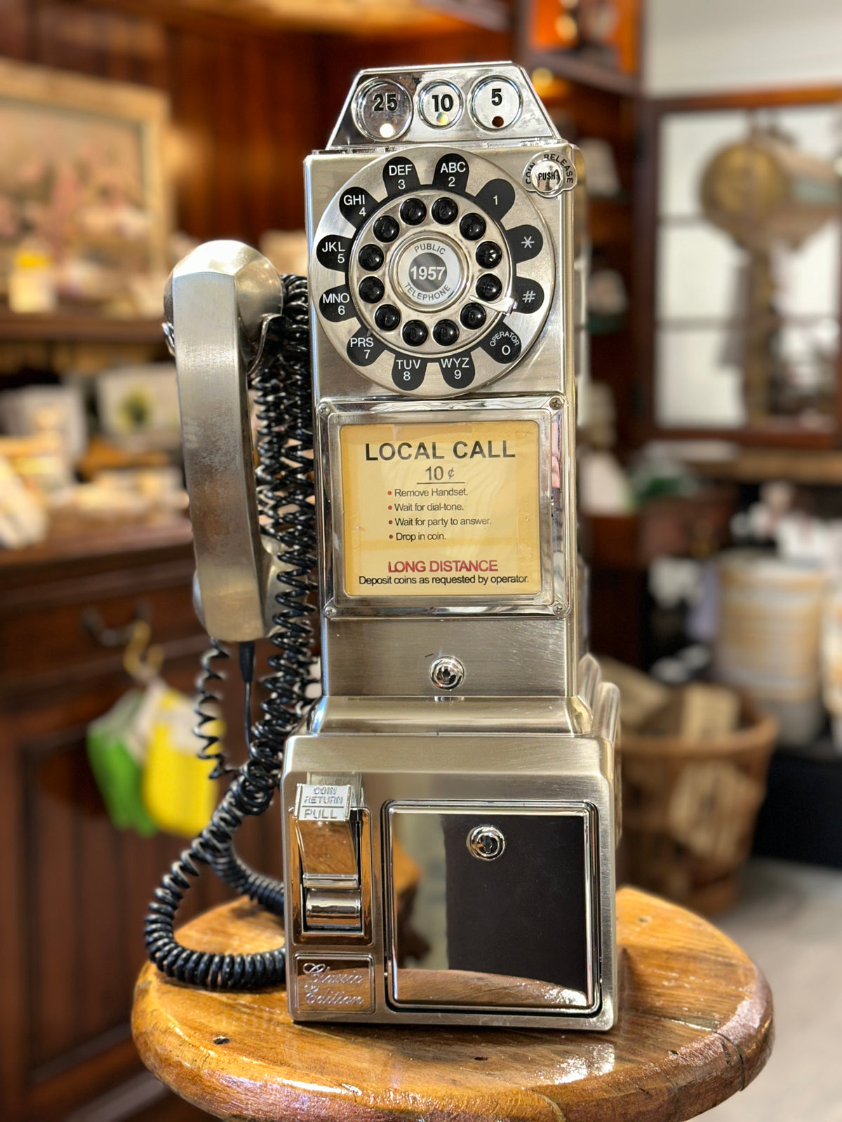 Vintage payphone collectible with original handset and coiled cord
