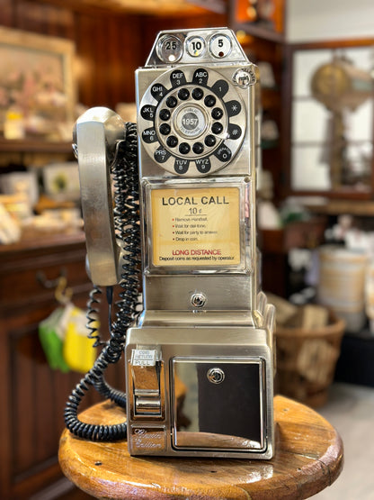 Vintage payphone collectible with original handset and coiled cord