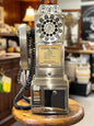 Vintage 1957 Classic Edition chrome payphone with rotary dial and coin slots