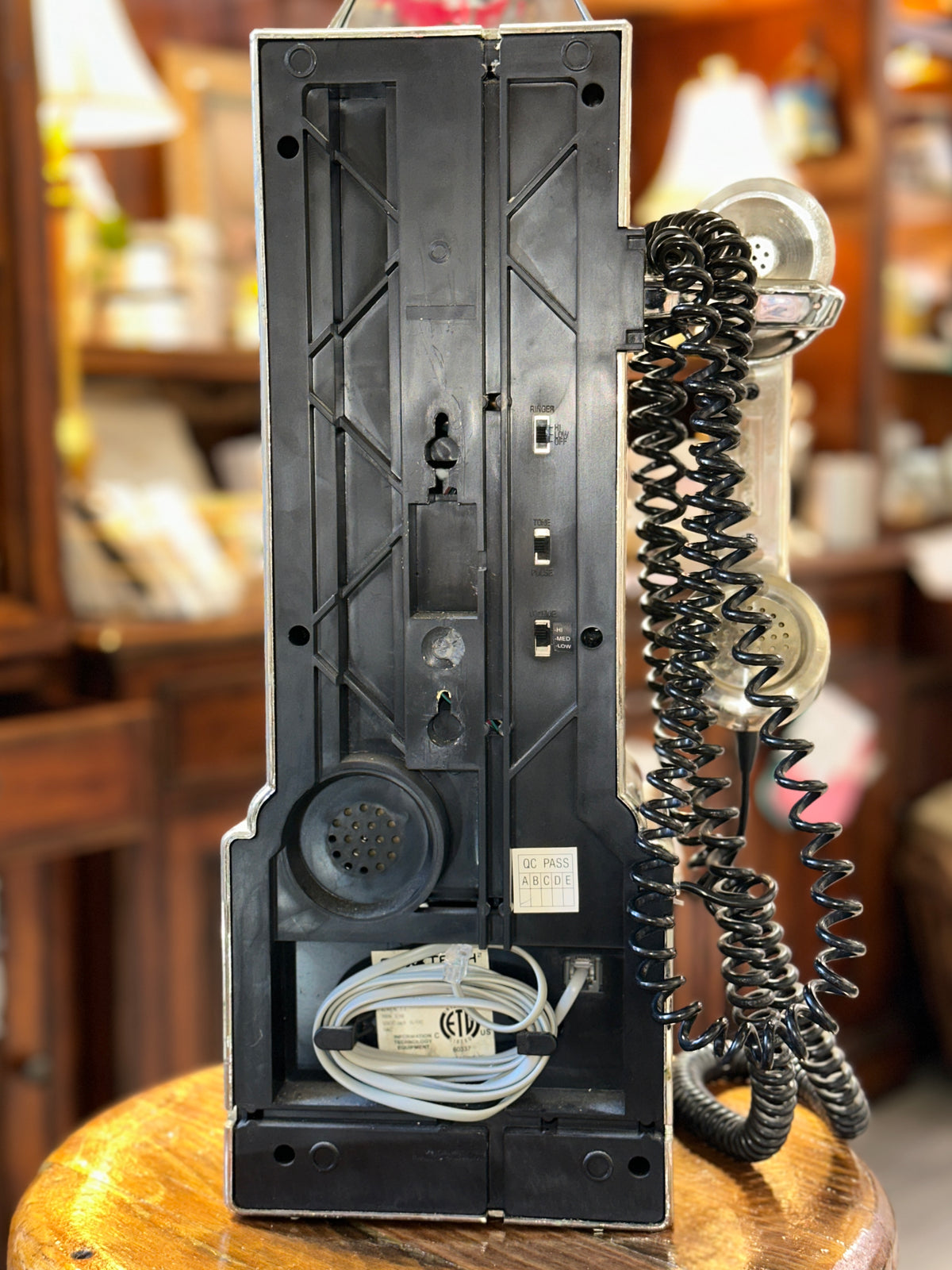 Back of vintage 1957 Classic Edition payphone showing wiring and switches