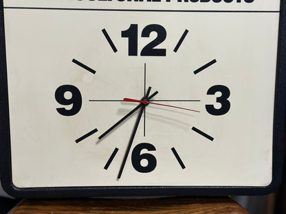 Close-up of the clock face showing the large black 12, 3, 6, and 9 numerals and the vintage hands in their present as-is condition.