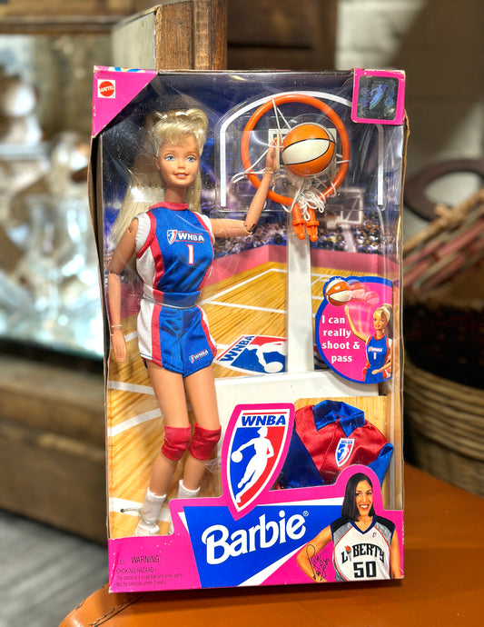 1998 Mattel WNBA Barbie basketball doll #20205 in original pink box with basketball hoop, ball, and blue and red uniform.