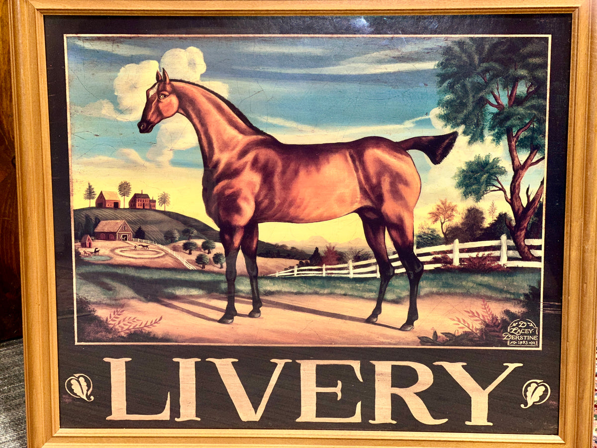 Framed equestrian wall art showing a chestnut horse with pastoral scenery and bold LIVERY lettering