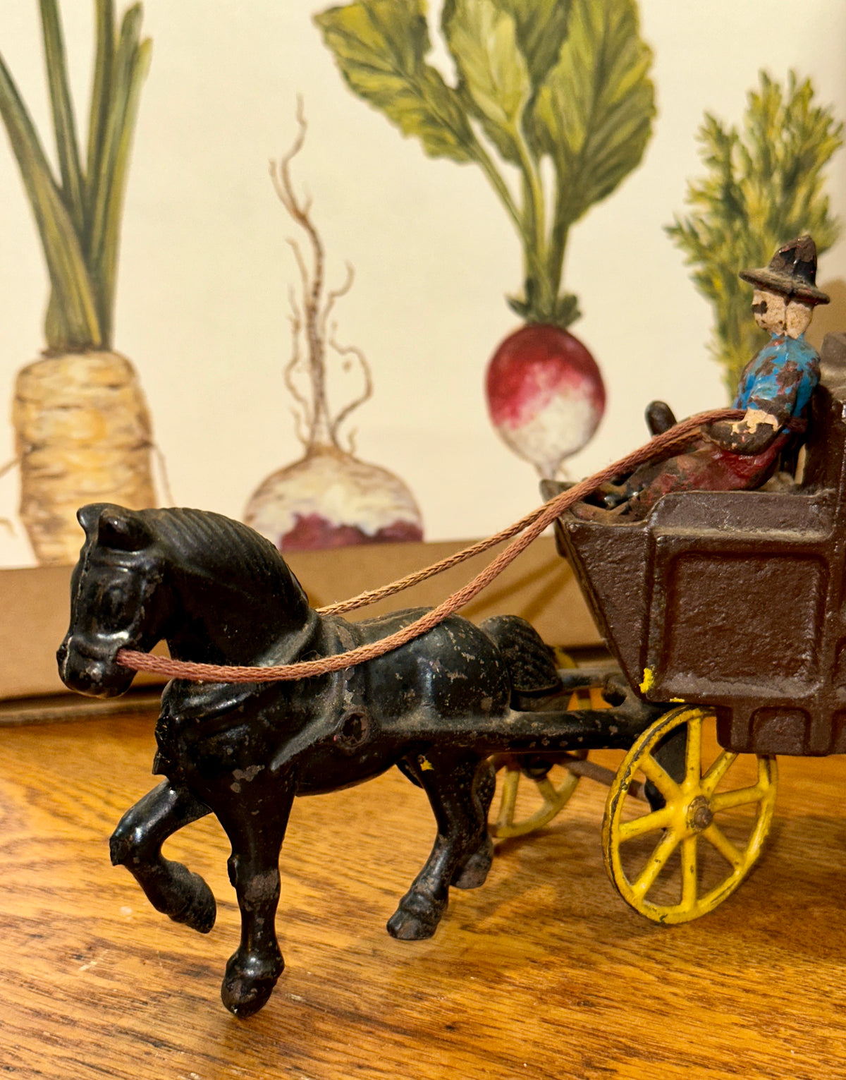 Vintage cast iron horse-drawn stagecoach with cowboy 