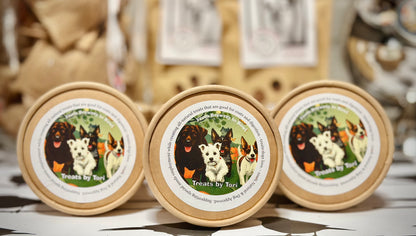 Three kraft tubs of Treats by Tori all-natural dog treats on display