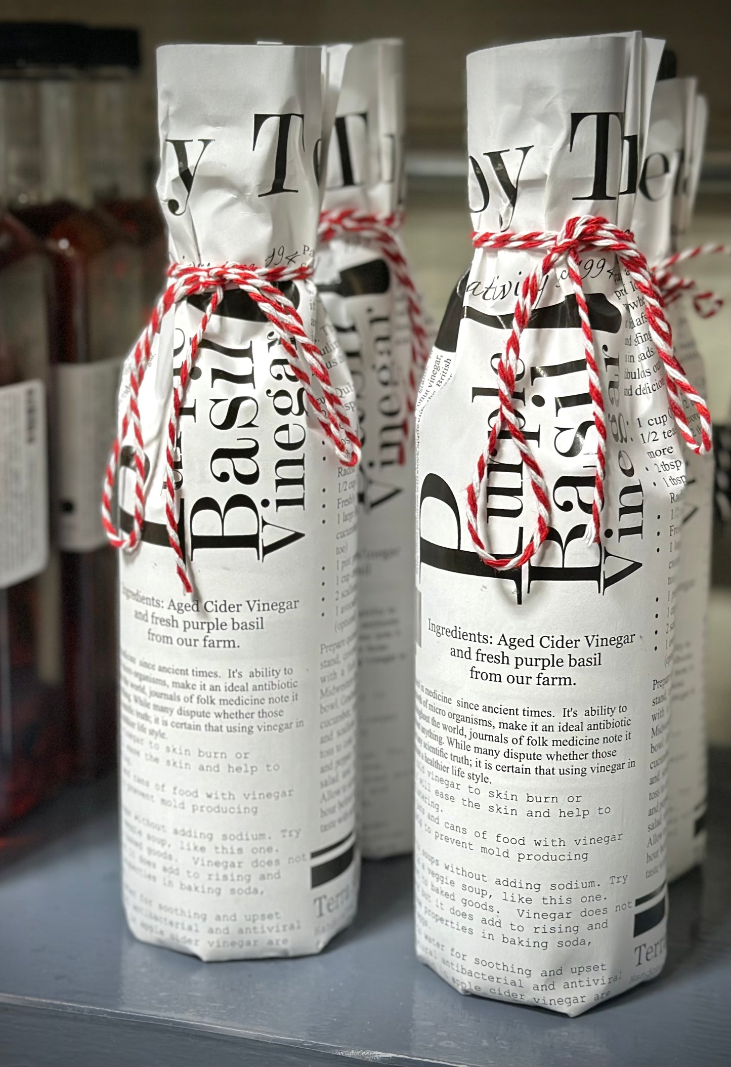 Purple basil vinegar with fresh purple basil leaves and Italian ingredients