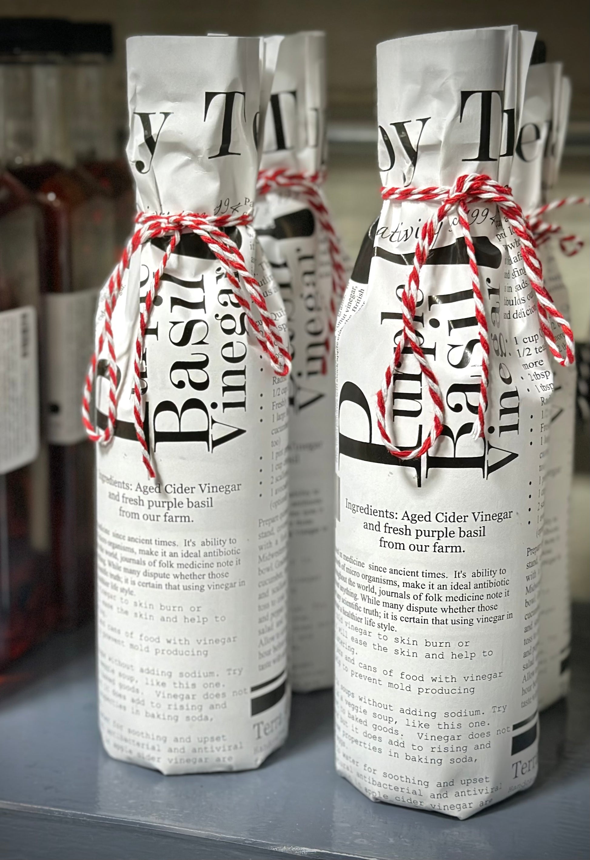 Purple basil vinegar with fresh purple basil leaves and Italian ingredients