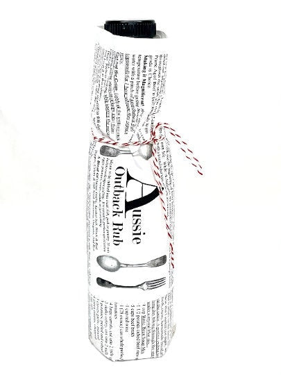 Close-up of gift-wrapped Aussie Outback Rub bottle with label and baker’s twine