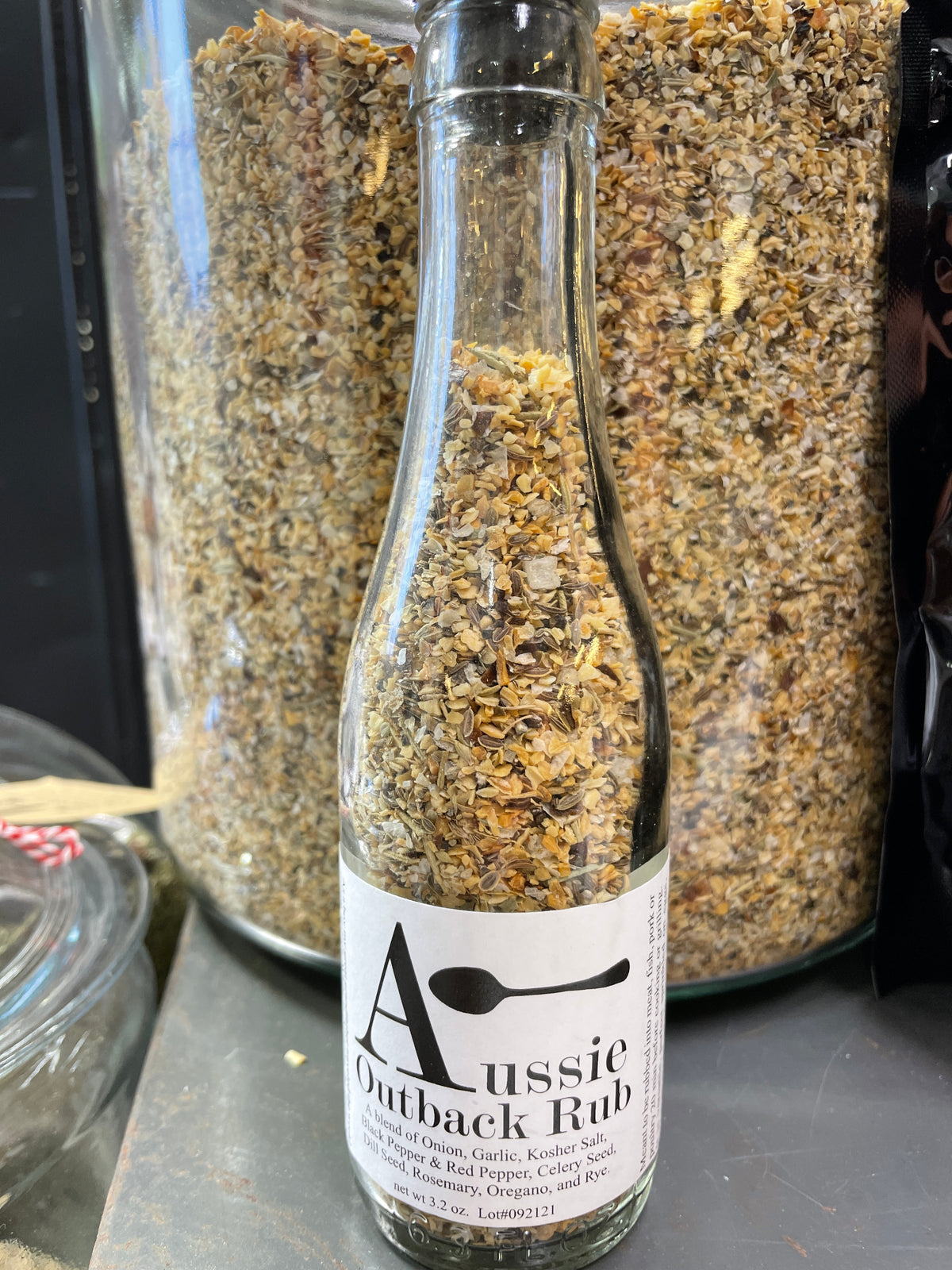 Aussie Outback Rub spice bottle displayed in front of the bulk seasoning blend