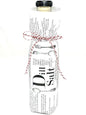 Dill Salt bottle gift-wrapped in printed paper and baker’s twine