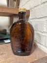 Vintage Log Cabin syrup bottle/flask amber embossed 1776