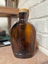 Vintage Log Cabin syrup bottle/flask amber embossed 1776