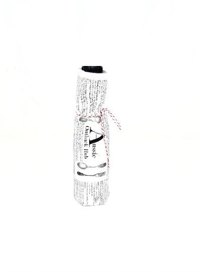 Aussie Outback Rub bottle wrapped in printed paper and tied with baker’s twine